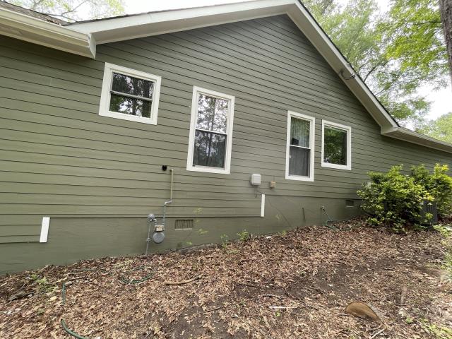 We replaced, the deck, windows, gutters and siding on a house in Powder Springs, Ga. 