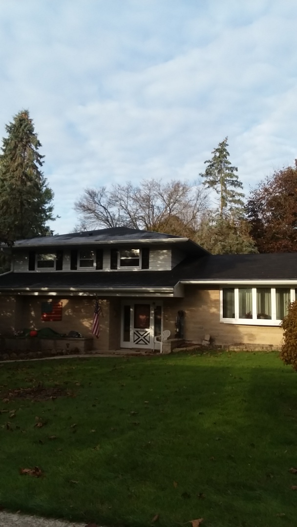 Installing gutter cap on upper story of housr