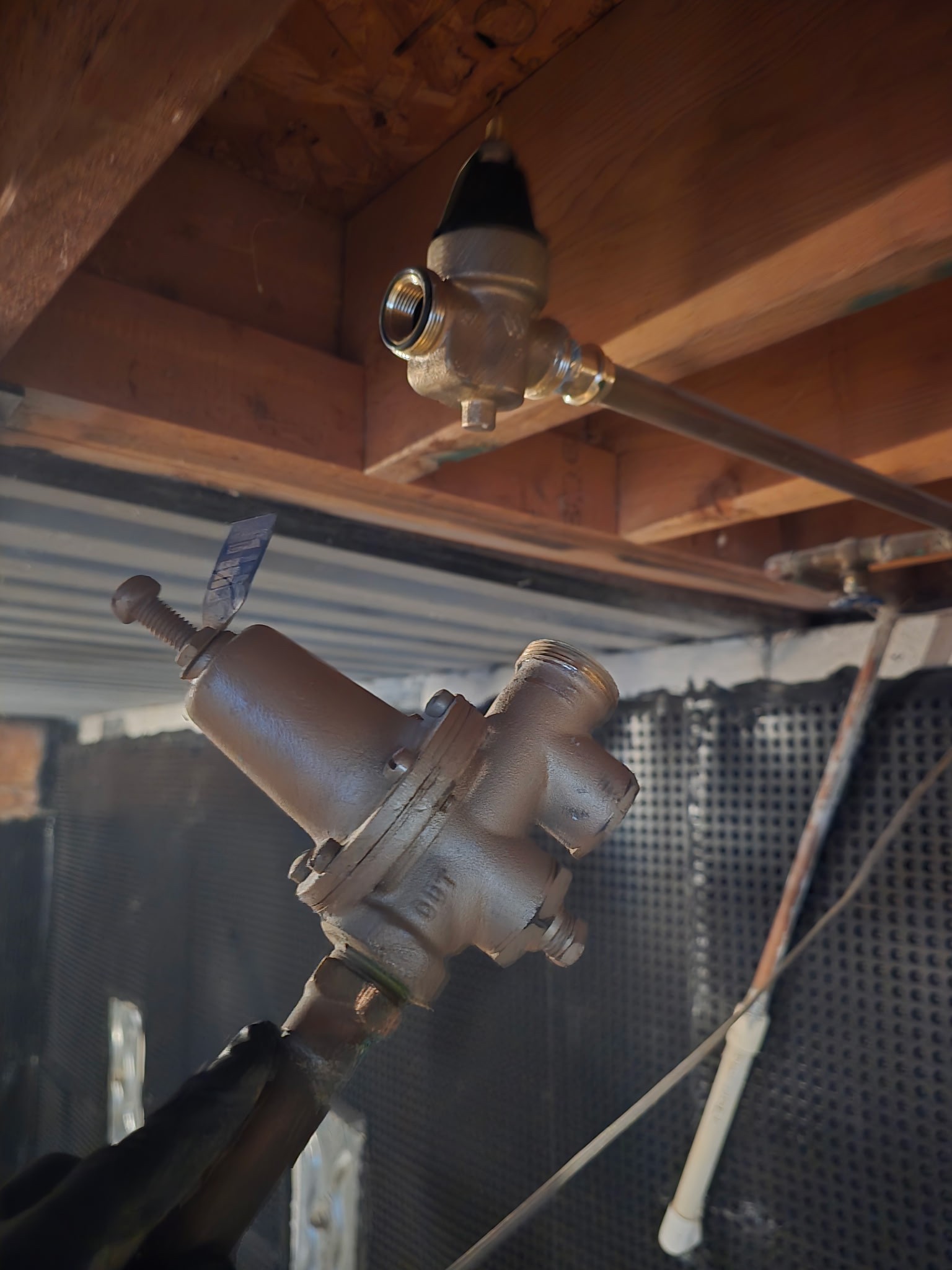 Upon receiving a service call, I addressed a dual issue involving an outdated toilet and unstable water pressure. The existing toilet was inefficient, and the pressure reducing valve (PRV) was failing to regulate pressure effectively. I began by removing the old toilet and installing a new, high-efficiency model, ensuring it was properly aligned and securely mounted. Next, I replaced the defective PRV valve with a new one, ensuring it was correctly installed to maintain optimal water pressure and protect the plumbing system. After completing the installations, I turned the water supply back on and tested all fixtures to confirm proper pressure and functionality. The new toilet operates flawlessly, and the entire system is now running safely and efficiently, all work completed to code with no leaks.