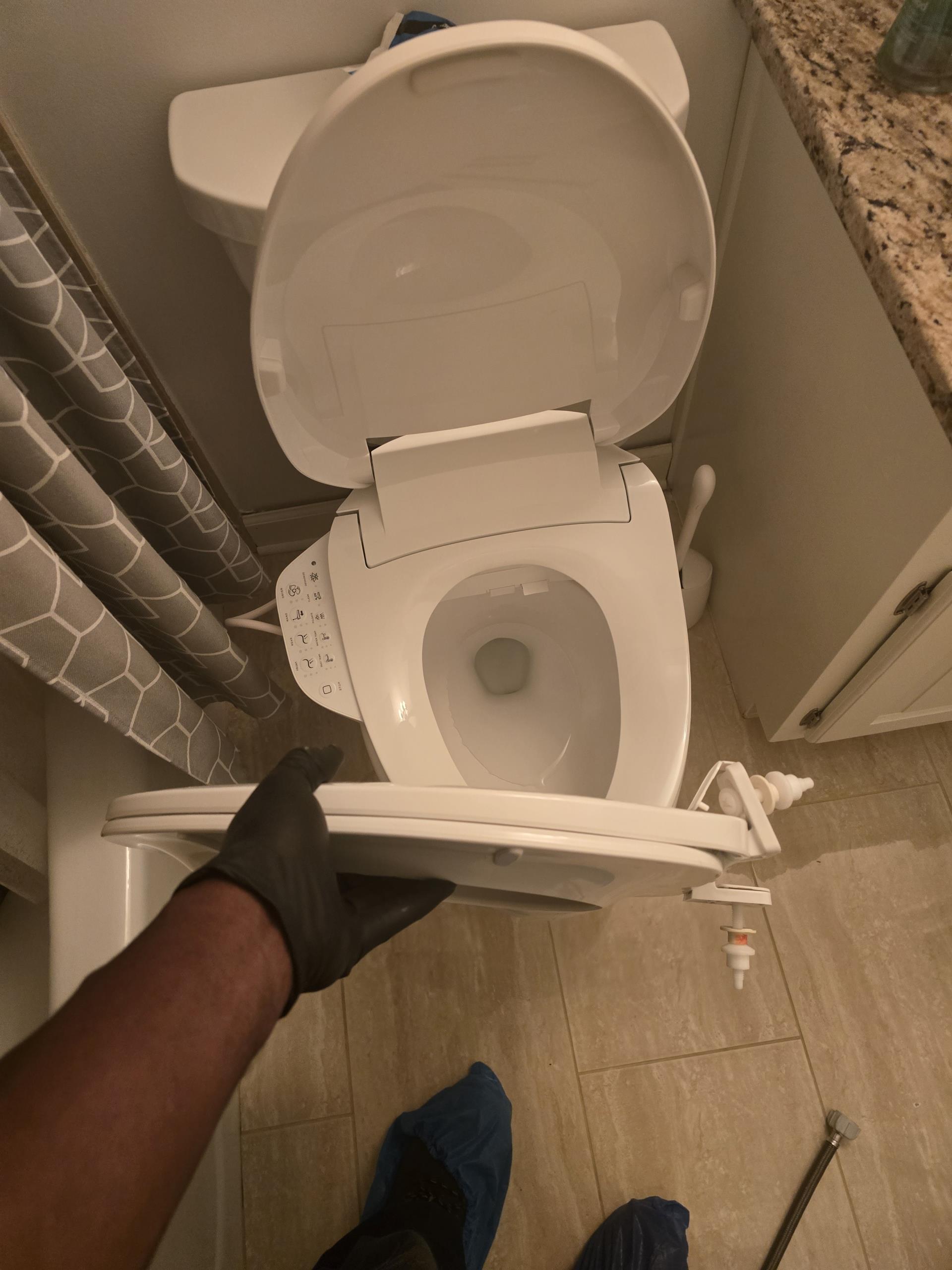 I successfully installed a Kohler electric bidet seat provided by the customer. The procedure began with shutting off the water supply entirely. I then removed the old seat and installed a specialized T-valve to ensure a secure water connection. The new bidet seat was integrated with the existing GFCI outlet. I conducted a thorough diagnostic on the heated seat, wash functions, and digital controls to confirm everything was working correctly. The system is now fully operational and ready for use.