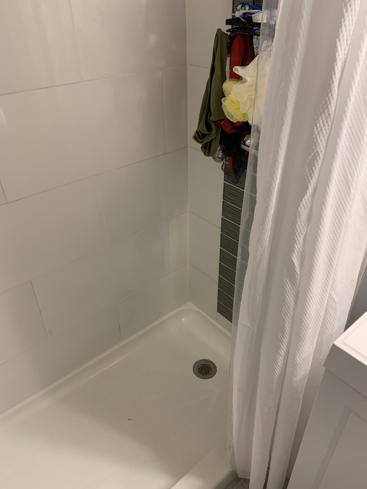 Inspect to find the source of a random water leak that is originating from the shower base.