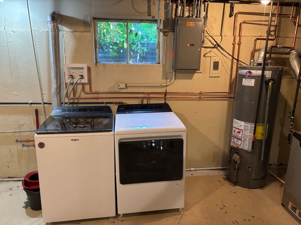 Update plumbing systems for a laundry room and mechanical area.