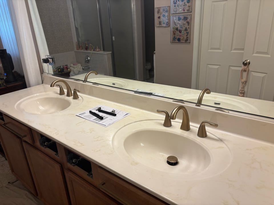 Replace bathroom faucets with new Delta fixtures provided by the customer to update the system. 
