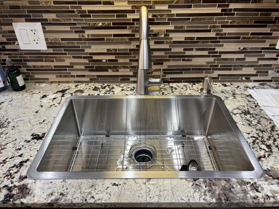 Replace a sink, faucet and garbage disposal to update the kitchen prior to the homeowner moving in.  Replace a sink, faucet and garbage disposal to update the kitchen prior to the homeowner moving in.