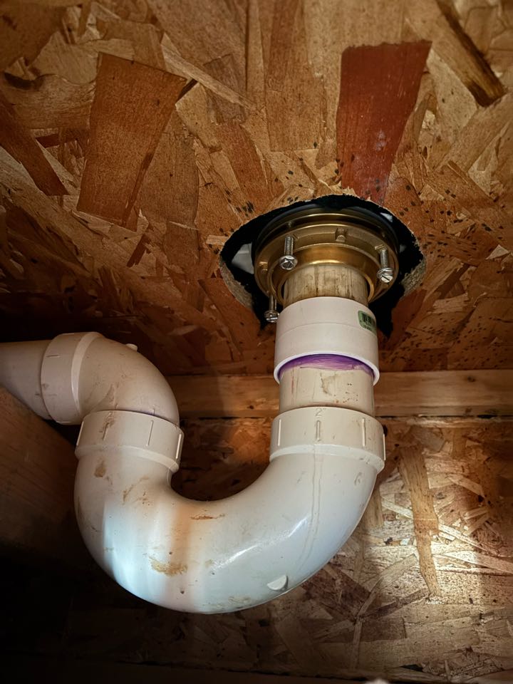 Replace a shower drain that was cracked and causing a leak to develop. Install a heavy duty solid brass body drain to replace the plastic one installed by the builder. 