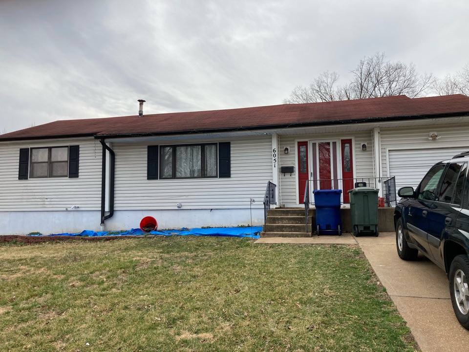 St. Louis, MO - EBS is replacing damaged 3-tab shingles that were blown off in high winds. St. Louis, MO - EBS is replacing damaged 3-tab shingles that were blown off in high winds.