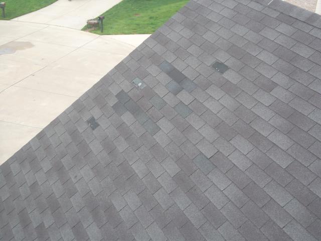 Eureka, MO - Inspecting roof with numerous shingles blown off Eureka, MO - Inspecting roof with numerous shingles blown off