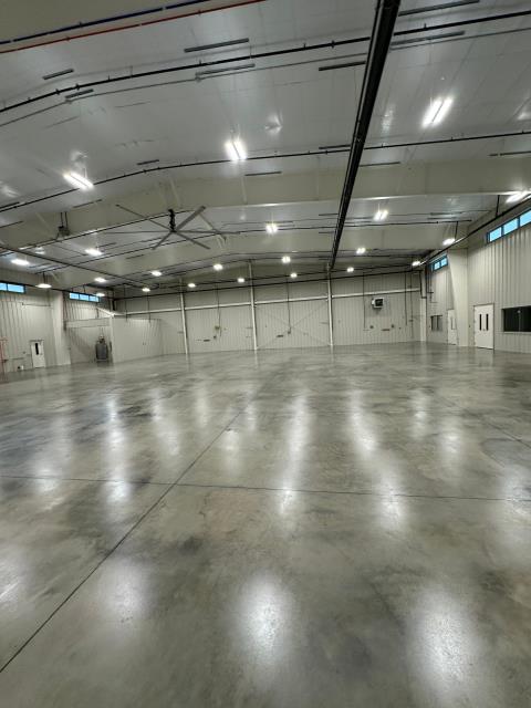 Auburn, AL - Sealed Concrete - Grind and Seal for a hanger before and after pictures