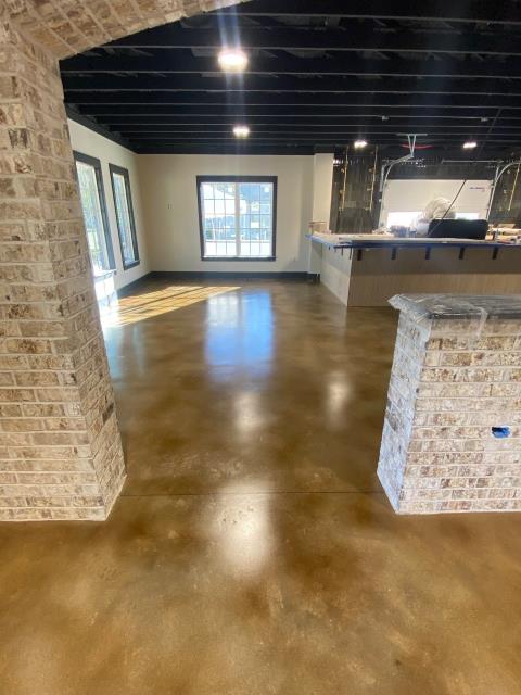Auburn, AL - Stained concrete with a polyurethane Satin Finish installed at Karvelas Pizza Company in Auburn, AL. 