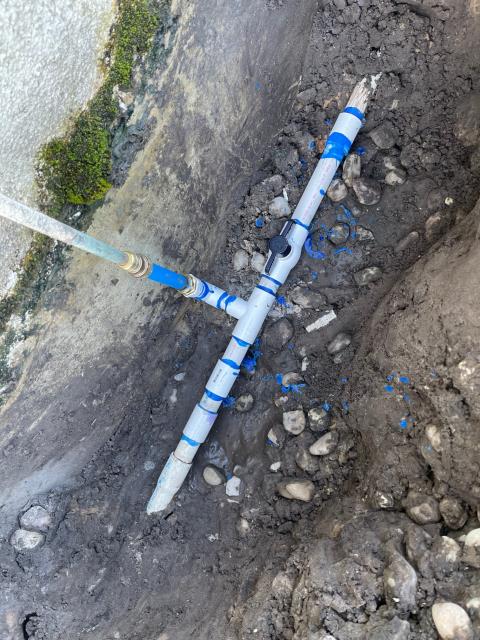 Dug up leaking pipe, found leak on 1 inch PVC tee, cut out entire manifold of piping and rebuilt with all new, checked and tested. No leaks videos and pictures are attached to the work order. Dug up leaking pipe, found leak on 1 inch PVC tee, cut out entire manifold of piping and rebuilt with all new, checked and tested. No leaks videos and pictures are attached to the work order.