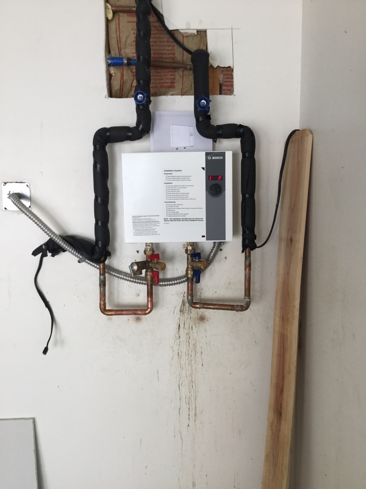 Plumber, plumbing, tankless water heater installation, water heater replacement. Installed new Bosch tankless water heater supplied by homeowner 