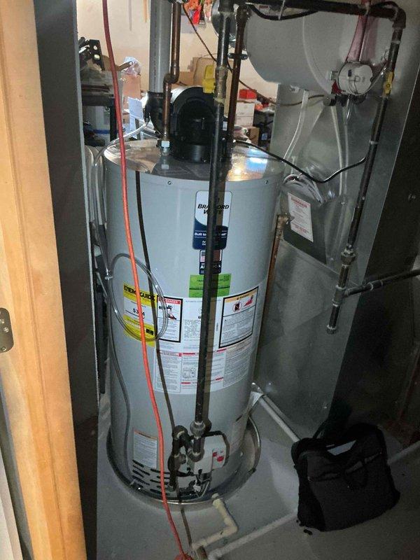 Completed full system evaluation for 16-year-old furnace replacement. Inspected existing installation including water heater connections and surrounding plumbing infrastructure. Customer is looking to replace system within one month; photos were taken of current setup to facilitate accurate equipment sizing and installation planning.