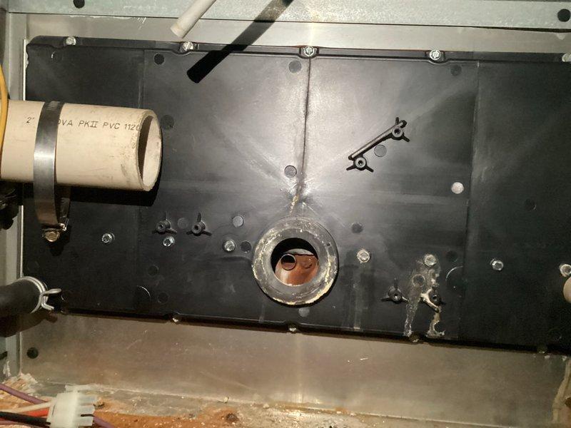 Performed diagnostic inspection on 23+ year old furnace that was not turning on. Discovered significant deterioration of heat exchanger with visible cracking around circular opening and copper components showing signs of wear. Documented system condition with photos showing metal fatigue, corrosion buildup, and potential safety hazards requiring complete assessment for veteran assistance program consideration.