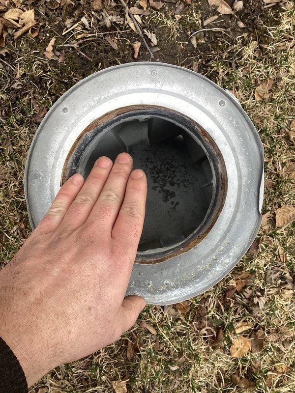 Responded to service call for a 3-year-old furnace where the cap on the exhaust pipe had blown off during a wind storm. Located and retrieved the dislodged ventilation component, which was found in the yard with minimal damage. Reinstalled the exhaust cap securely to restore proper system operation and prevent future dislodgment. Equipment is under parts warranty but not labor warranty.