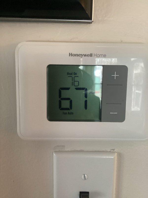 Responded to no heat complaint on a 3-year-old furnace still under warranty. Discovered thermostat was functioning correctly (set to 76° with "Heat On" displayed) but furnace wasn't activating. Determined GFCI outlet powering the furnace had tripped; reset the outlet which restored power and returned heating functionality to normal operation.