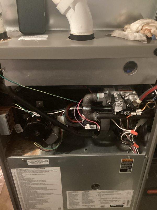 Performed scheduled Air Handler Cooling maintenance service. Inspected interior components of the furnace system including electrical connections, PVC venting, and gas fittings. Noted minor corrosion at pipe connection point requiring monitoring on next maintenance visit.
