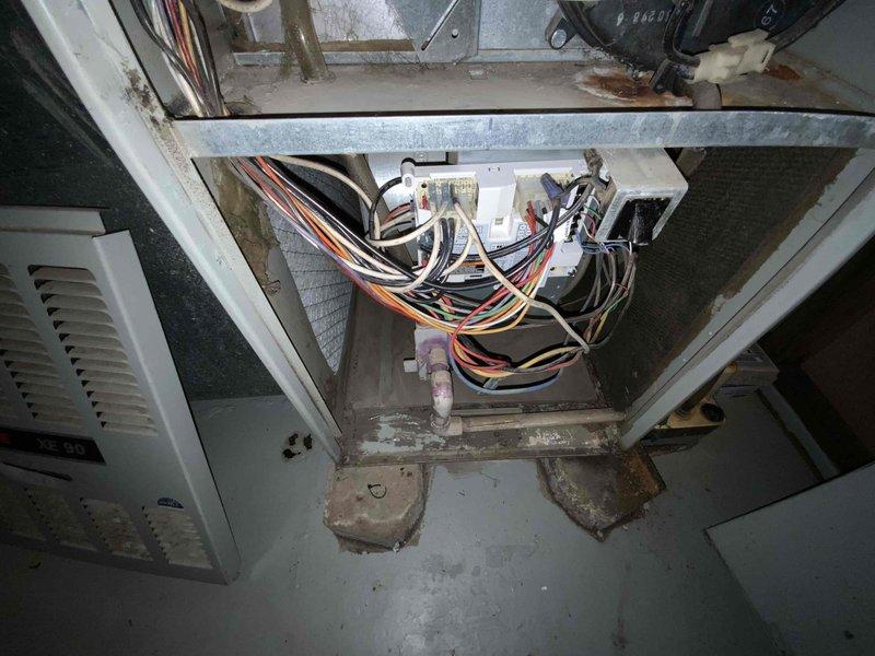 Performed inspection and estimate for replacement of aging 30-35 year old furnace and A/C system located in basement. Current equipment is operational but nearing end of serviceable life. Noted deteriorated wiring connections in control box and signs of wear on main furnace components. System replacement recommended due to equipment age and to improve energy efficiency.