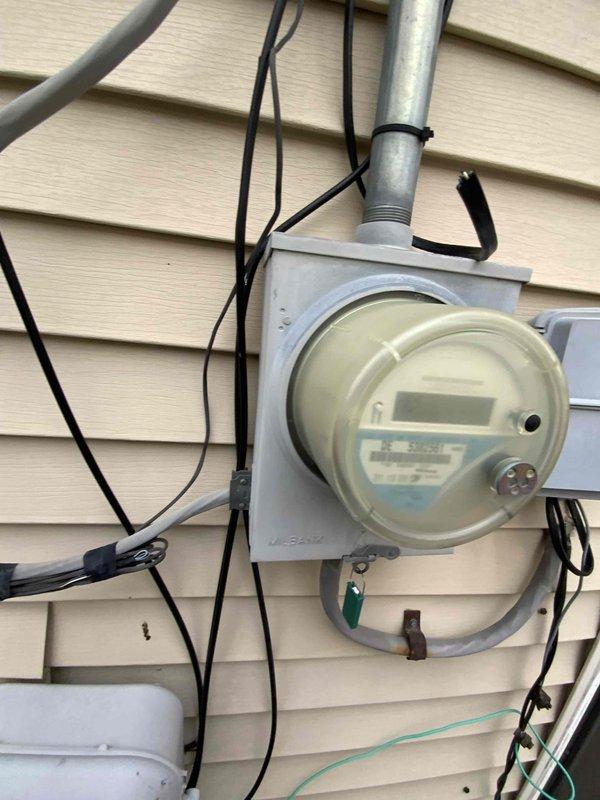 Performed comprehensive assessment for full HVAC system replacement in 1100 square foot residence with 16-year-old furnace. Inspected current installation configuration in utility area, evaluated existing ductwork connections, and documented electrical service capacity via exterior meter. Customer requires immediate replacement of both furnace and air conditioning components.