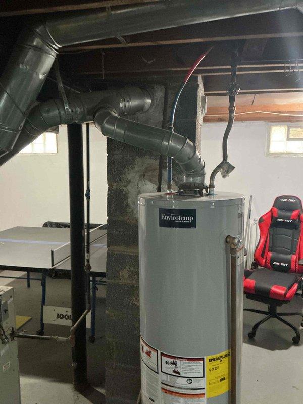 Conducted an HVAC replacement estimate for a 15-year-old non-operational furnace and AC system located in the basement. Evaluation included inspection of the existing natural gas furnace with connected ductwork and assessment of the surrounding installation environment, which features adequate space despite sharing the area with recreational equipment.