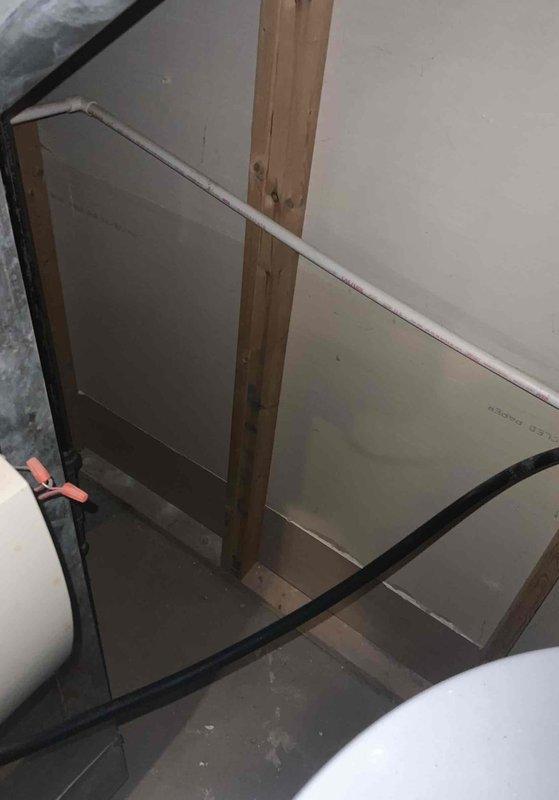 Conducted assessment for furnace and A/C replacement in basement location. Current heating system non-operational at 31 years of age. Documented exterior electrical service configuration and interior plumbing/framing elements to evaluate installation requirements for new HVAC system.