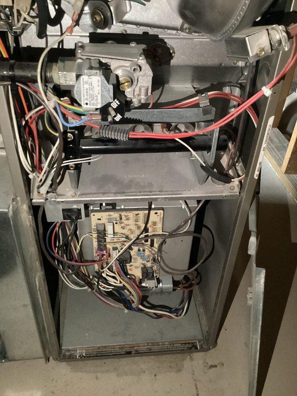 Completed quarterly Air Handler Maintenance service on residential HVAC system. Inspected furnace interior components including gas valve assembly, circuit board, and wiring connections - all found in proper working condition with no visible damage. Examined insulated hot and cold water lines and ductwork in utility area, confirming proper installation and absence of leaks or deterioration.