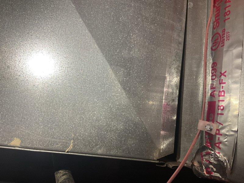 Responded to callback for duct seam violation repairs. Inspected HVAC system and sealed all accessible duct joints with ARPY 181B-FX approved sealing material to meet code requirements. Documented completed repairs with photos showing proper sealing of metallic connections.