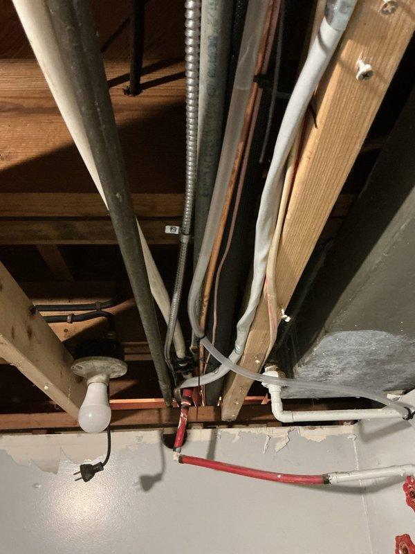 Completed violation repair by installing electrical panel cover with properly labeled circuits and installing code-compliant GFCI service receptacle for AC unit. Visual inspection of basement/crawlspace area confirmed proper installation of electrical components and connection to existing HVAC system.