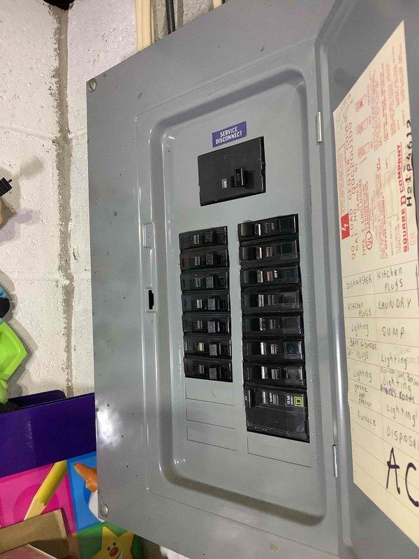 Conducted site assessment for whole-home standby generator installation at existing customer's residence. Evaluated electrical service panel (approximately 20 circuits) and existing mechanical infrastructure including gas line access. Photos documented current panel configuration and utility connections to determine appropriate generator sizing and installation requirements.