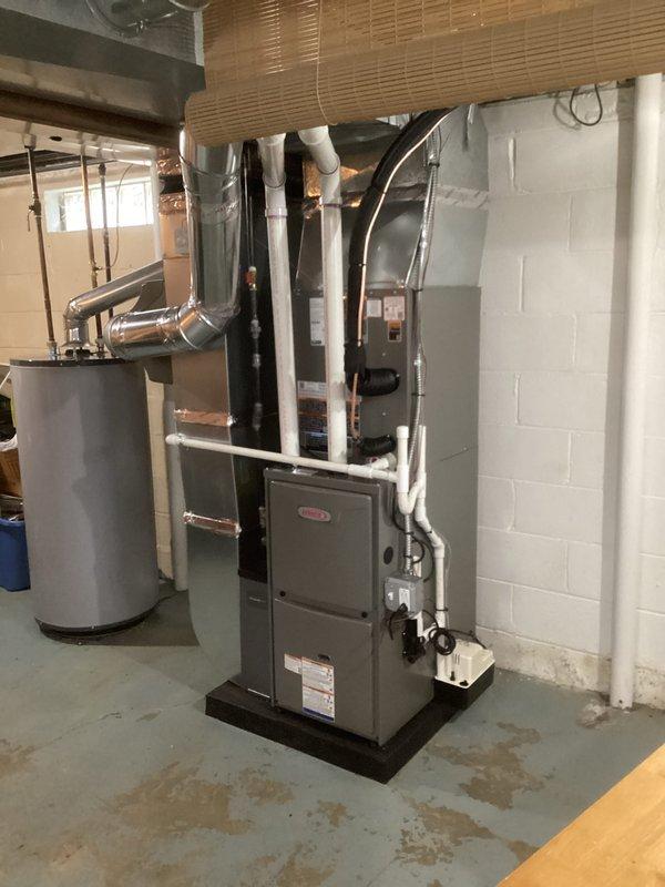 Completed installation of a complete HVAC system including a 70,000 BTU furnace and 2.5-ton air conditioning unit at the rear of the property. System installation included humidifier integration and all necessary mechanical and electrical reconnections, with proper permits obtained for mechanical and electrical work.