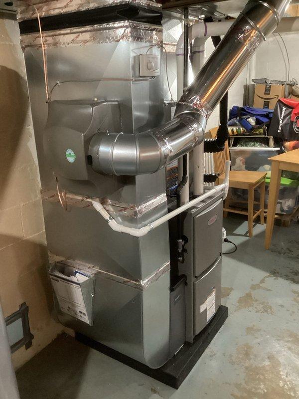 Completed installation of a complete HVAC system including a 70,000 BTU furnace and 2.5-ton air conditioning unit at the rear of the property. System installation included humidifier integration and all necessary mechanical and electrical reconnections, with proper permits obtained for mechanical and electrical work.