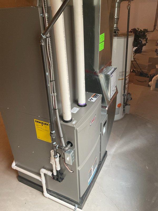 Performed annual heating maintenance service on the residential HVAC system. Conducted thorough inspection of the furnace unit, examining internal components including blower motor assembly, electrical connections, and ventilation system. System was found to be in good working condition with proper installation of PVC exhaust pipes and appropriate ductwork connections.