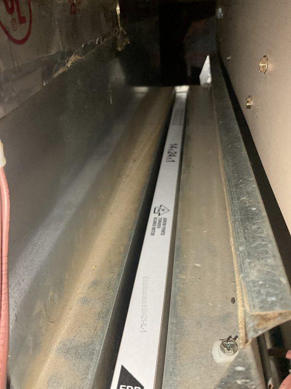 Performed scheduled AHM service on furnace unit. Inspected control components, heat exchanger assembly, and electrical wiring harness. Noted some dust accumulation on interior surfaces but system appears to be functioning normally with all connections secure.