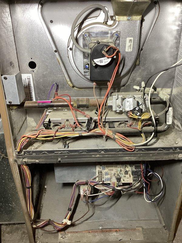 Diagnosed 10-year-old inoperative furnace following power outage. Inspection revealed failed control board with visible burn marks and component damage. Recommended full system replacement due to age of unit and extensive control board failure that would not be cost-effective to repair.