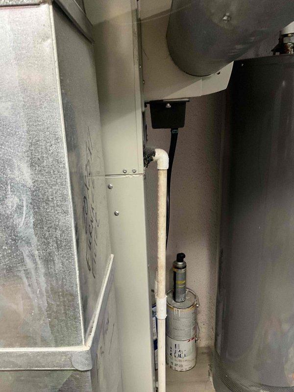 Performed comprehensive inspection of 29-year-old furnace system in residential property. Documented existing installation including metal ductwork configuration, current filter specifications (20x5x1), and drainage system with PVC piping. Provided homeowner with replacement options for aging unit, noting system has exceeded typical service life expectancy.