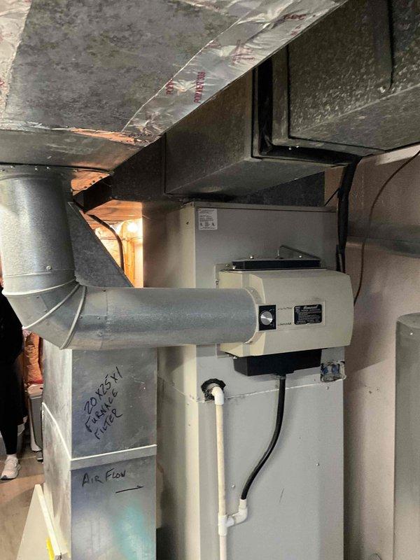 Performed comprehensive inspection of 29-year-old furnace system in residential property. Documented existing installation including metal ductwork configuration, current filter specifications (20x5x1), and drainage system with PVC piping. Provided homeowner with replacement options for aging unit, noting system has exceeded typical service life expectancy.