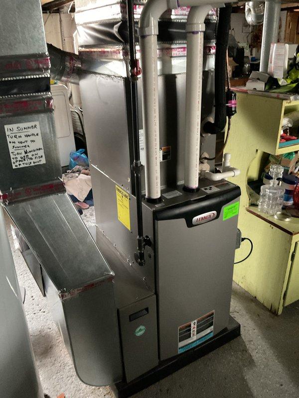 Performed annual HVAC maintenance on Lennox furnace system. Inspected interior components including motor assembly, control board, and electrical connections. All components functioning properly with no issues observed in wiring or mechanical parts. System has proper venting with PVC exhaust pipes and appropriate ductwork connections.