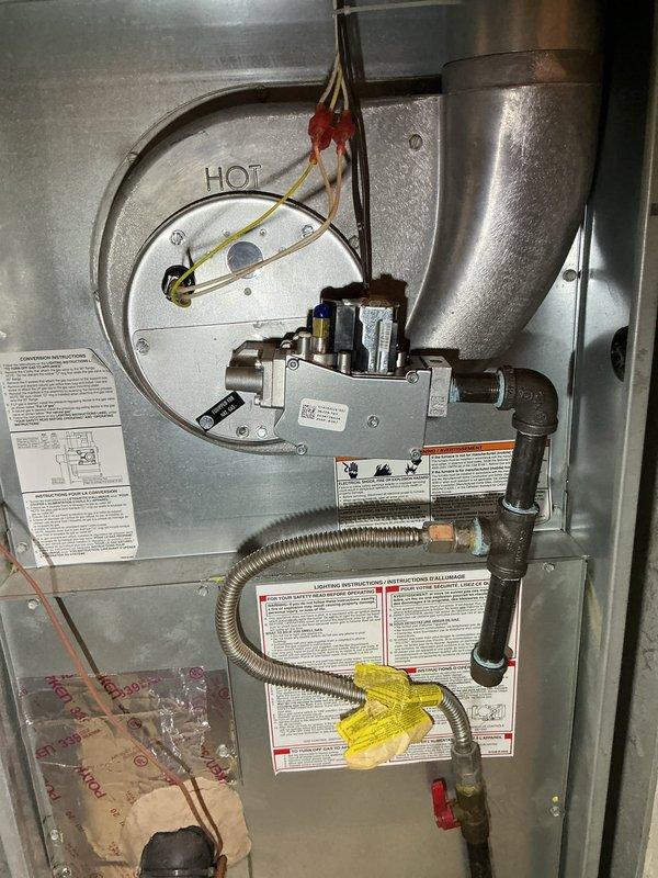 Replaced faulty gas valve in furnace with new unit. Verified proper installation with dual port manometer testing, confirming appropriate gas pressure readings of 348 on both ports. System now functioning correctly with all connections secure and operational.