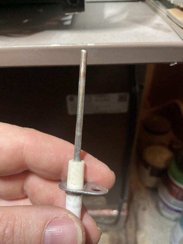 Performed scheduled air handler maintenance and replaced ignition electrode showing signs of wear and discoloration. Inspected and tested all components to ensure proper operation after replacement.