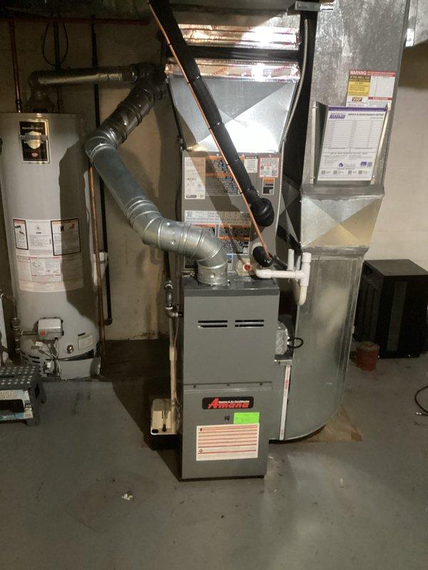 Successfully installed a new 2-ton Amana A/C system with matching coil in the basement utility area. Complete installation included proper connection of metallic ductwork, condensate drain line to pump, and all electrical connections according to mechanical and electrical permits. System was tested and verified to be operating according to manufacturer specifications.