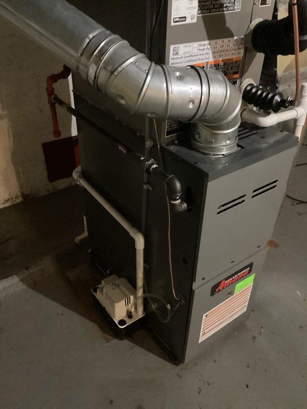 Successfully installed a new 2-ton Amana A/C system with matching coil in the basement utility area. Complete installation included proper connection of metallic ductwork, condensate drain line to pump, and all electrical connections according to mechanical and electrical permits. System was tested and verified to be operating according to manufacturer specifications.