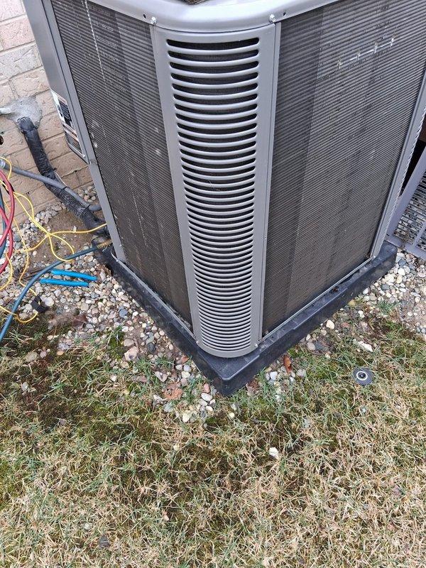 Performed scheduled Air Care Cooling and Heating maintenance service on the outdoor AC/heat pump unit. Inspected system components, noting weathered exterior with dirt buildup on housing and ventilation fins. Replaced filter and pad as part of regular maintenance protocol.
