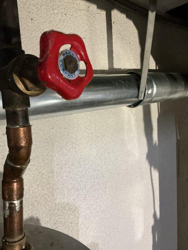 Successfully installed a complete HVAC system including a 70,000 BTU furnace and 2.5-ton air conditioning unit with proper mechanical and electrical connections. System features dual PVC ventilation pipes and includes all necessary plumbing components with copper piping and control valves for optimal operation.