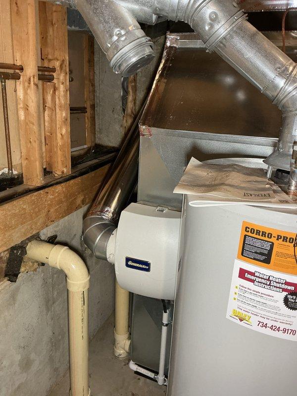 Completed installation of complete HVAC system including 70,000 BTU Goodman furnace and 2.5-ton air conditioning unit. System includes properly sized and installed metal ductwork with insulated connection points, PVC condensate drainage lines, and all necessary electrical connections. Mechanical permits were obtained and all manufacturer specifications were followed for proper system operation.