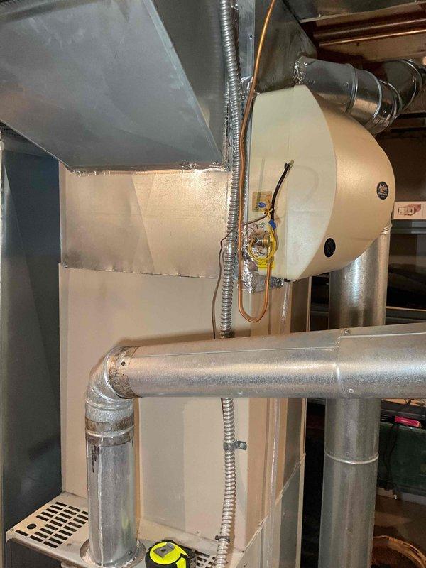 Completed comprehensive assessment of existing HVAC system for mid-large residence (2000-3000 sq.ft.) with natural gas/propane heating and cooling unit located in basement. Documented current installation including furnace/air handler with connected ductwork, associated electrical components, and examined electrical panel to verify proper circuit configuration for proposed system replacement.