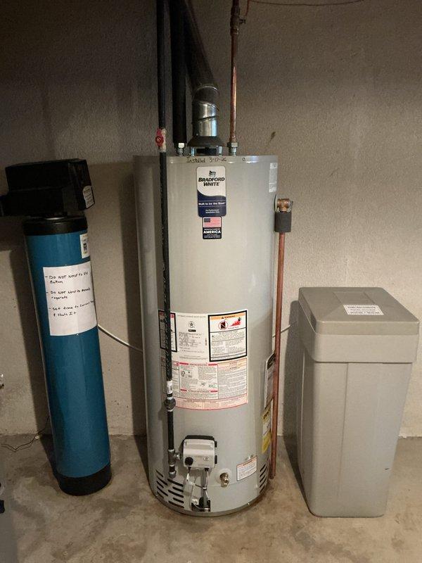 Successfully completed installation of a Bradford White GS6-50-BRT-400 tanked water heater under warranty service. Unit was properly connected to existing copper piping with all necessary connections to the home's water system and installed alongside existing water filtration/treatment equipment. Required permits were requested prior to installation.