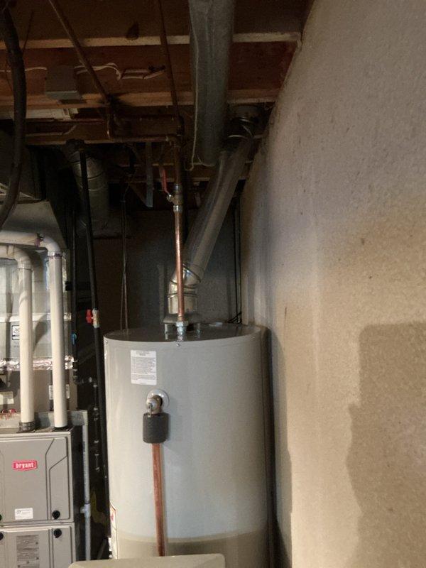 Successfully completed installation of a Bradford White GS6-50-BRT-400 tanked water heater under warranty service. Unit was properly connected to existing copper piping with all necessary connections to the home's water system and installed alongside existing water filtration/treatment equipment. Required permits were requested prior to installation.