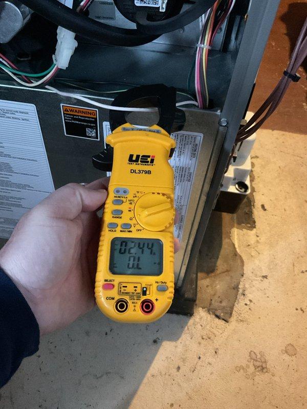 Completed ComfortGuard Maintenance Package service on HVAC system, performing comprehensive electrical diagnostics with UEi DL379B clamp meter to verify proper voltage and current readings. Conducted thorough inspection of internal components including blower motor assembly, circuit board connections, and wiring harness, confirming all systems are operating within normal parameters.