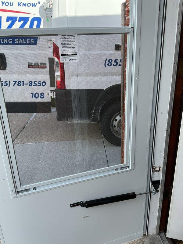 Responded to call back to replace a broken commercial screen door. Removed damaged door and installed new unit with push bar hardware. Verified proper operation and secure mounting of the replacement door.