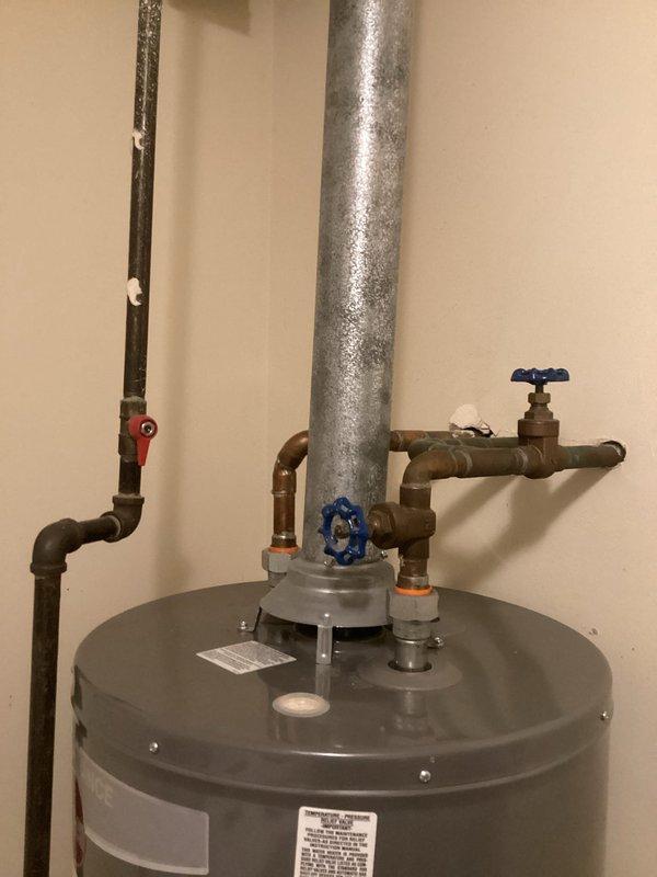 Diagnosed and repaired leaking tank-style water heater in laundry room of 7-year-old residence. Inspected copper supply lines, valve connections, and T&P relief valve, identifying source of leak and implementing necessary repairs to restore proper operation. System was pressure-tested after repair to confirm leak resolution and ensure safe, compliant functionality.