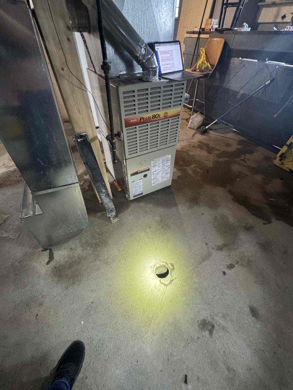 Conducted site assessment for furnace replacement due to no heat issue. Existing unit is a Plus 80E model less than one year old located in basement with natural gas connection. Measured ductwork dimensions and evaluated current installation configuration to prepare appropriate replacement estimate.